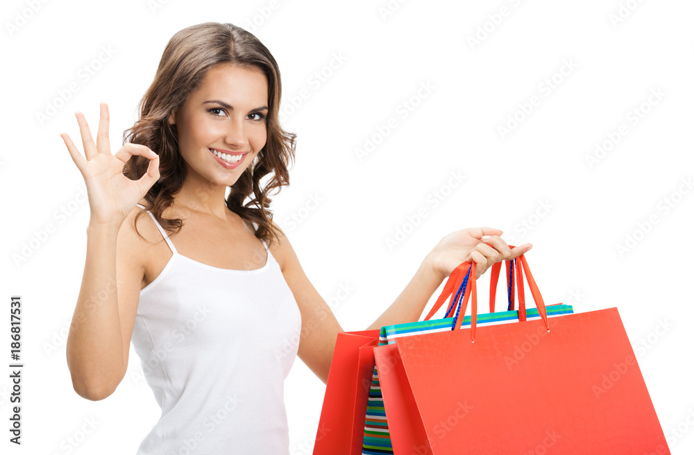 Young happy woman with shopping bags, isolated Young happy woman with shopping bags, isolated
