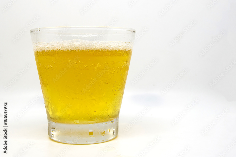 Close up beer glass has beer in the glass on whith background Close up beer glass has beer in the glass on whith background