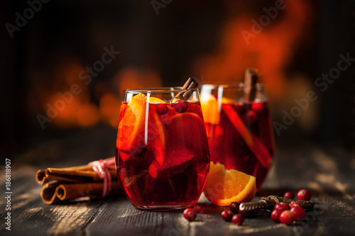 Mulled wine with orange and a cranberry photo