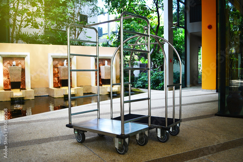 Photography Empty hotel baggage cart in the hotel background or Empty bellman's luggage cart