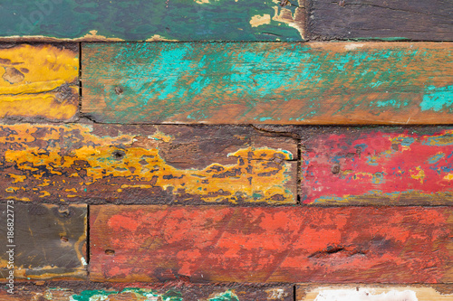Weathered colorful wooden wall for background