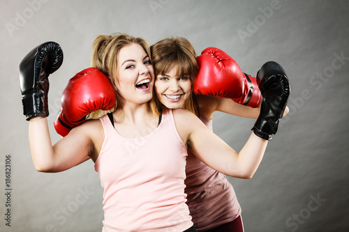 Two women friends wearing boxing gloves © anetlanda
