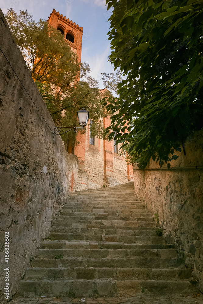 A narrow street of italy with steps of stone. Monselice, Italy.