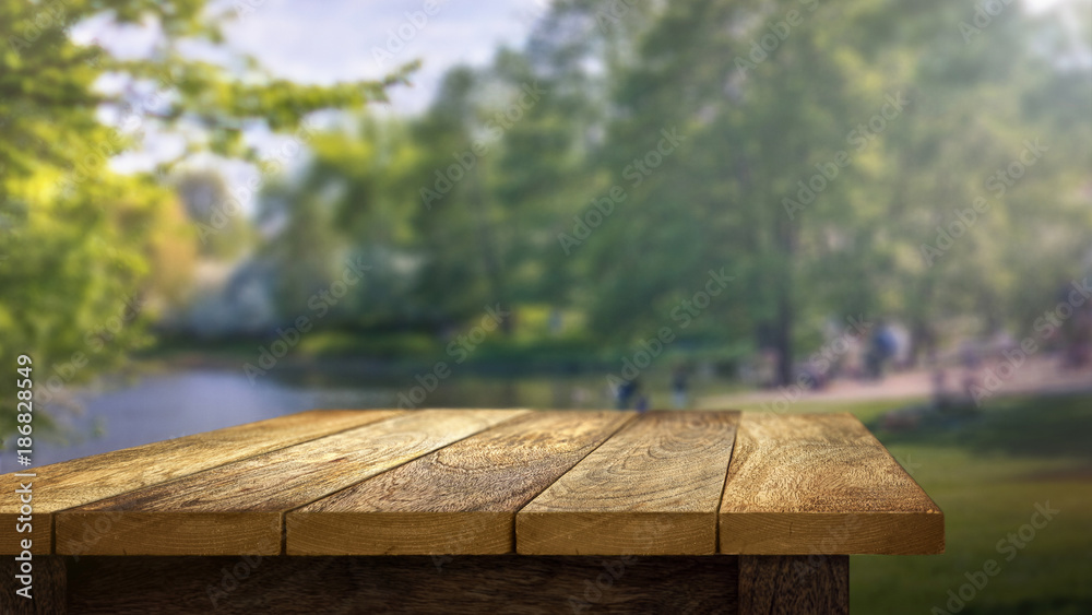 Wooden Table outside in park background