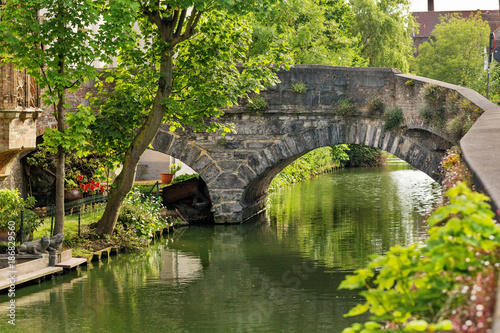 The bridge ancient of a stone via the channel in Bruges  Belgium