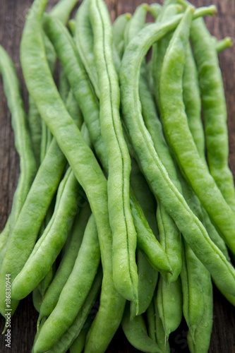 Organic Green Vegetable Cordyceps, which are vegetarian vital vitamins, beans on the wood tabletop,