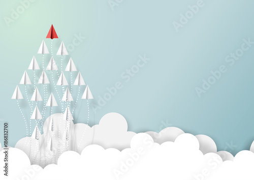 Paper airplanes in form of arrow shape flying from clouds on blue sky.Paper art style of business teamwork creative concept idea.Vector illustration