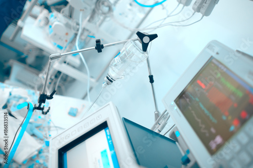 Life support devices connected to the critical condition patient in the ICU photo