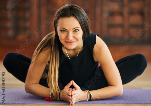 Young woman yoga trainer