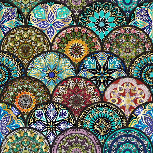 Colorful floral seamless pattern from circles with mandala in patchwork boho chic style