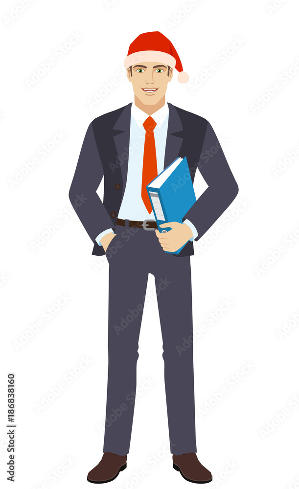 Businessman in Santa hat with hand in pocket holding a folder Businessman in Santa hat with hand in pocket holding a folder