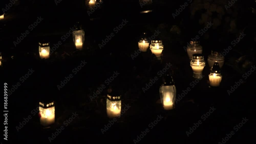 hand put burning candle on tombstone in cemetery. 4K hand put burning candle on tombstone in cemetery. 4K