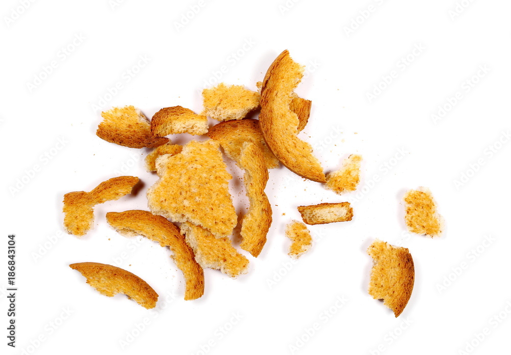 Integral crumbled rusks with wholewheat flour, bread slices isolated on white background, top view Integral crumbled rusks with wholewheat flour, bread slices isolated on white background, top view