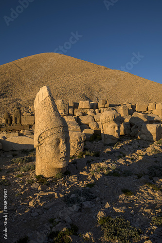 Toppled heads of the gods on East terrace at the top of Nemrut dagi in Turkey. The UNESCO World Heritage Site at Mount Nemrut where King Antiochus is reputedly entombed.