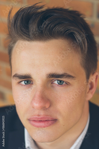 Close up face portrait of young model businessman