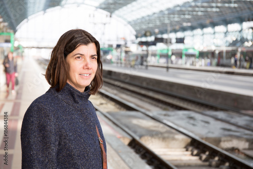 Pretty young woman at a train station