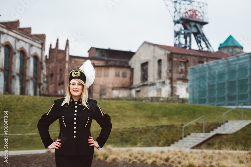 Obraz na płótnie Working woman miner in gala parade uniform. w salonie