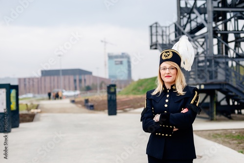 Obraz na płótnie Working woman miner in gala parade uniform. w salonie