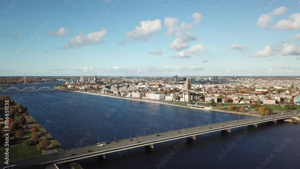 Cars on river Daugava bridge Riga Latvia aerial drone top view view 4K UHD video 