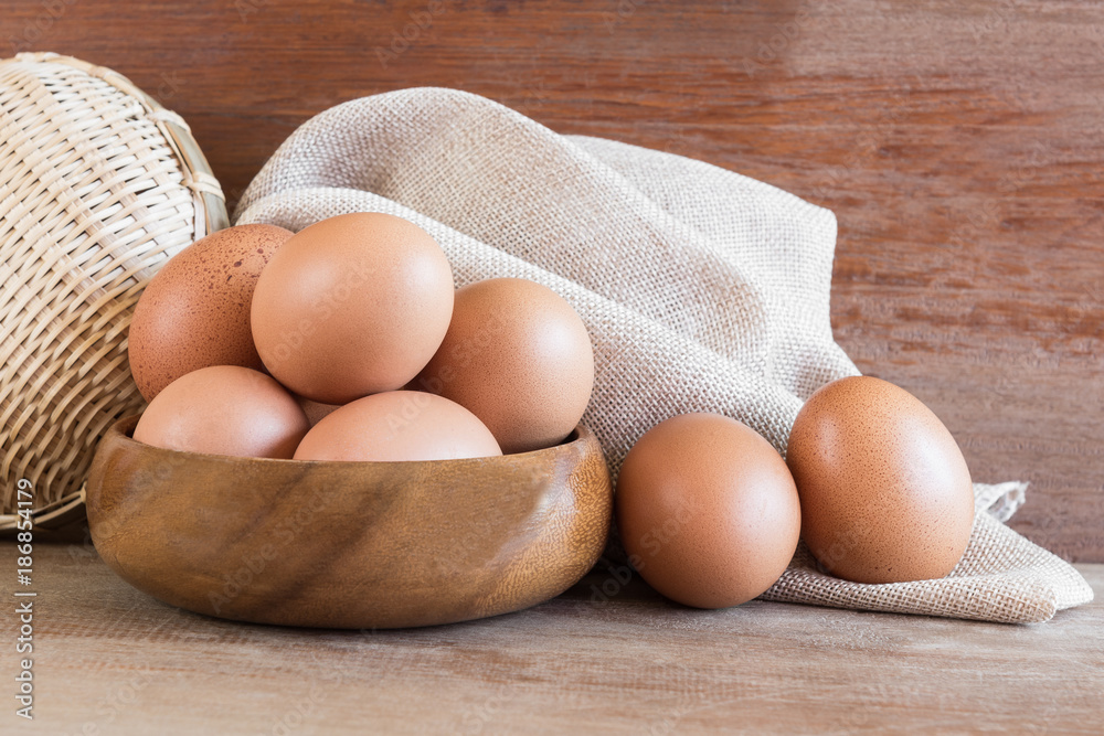 group of raw chicken egg on wooden table prepare to cook, copy space for text. healthy food concept. group of raw chicken egg on wooden table prepare to cook, copy space for text. healthy food concept.