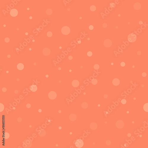 Light polka dots seamless pattern on coral background. Nice classic light polka dots textile pattern in restrained colours. Seamless scattered confetti fall chaotic decor. Vector illustration.