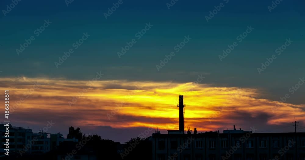 Time lapse of beautiful sunset over an industrial part of the city with a tower Time lapse of beautiful sunset over an industrial part of the city with a tower