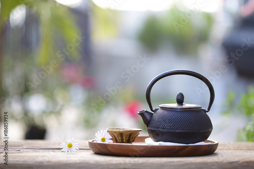 Black vintage teapot and cup at outdoor