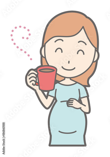 A pregnant woman in green drinking coffee