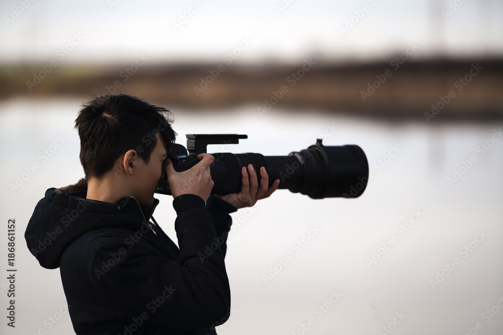 portrait with young wildlife photographer in nature portrait with young wildlife photographer in nature