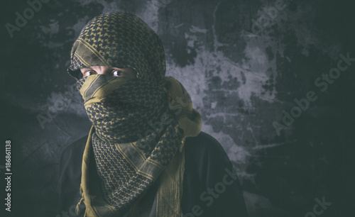 Masked criminal portrait with grungy background concept photo