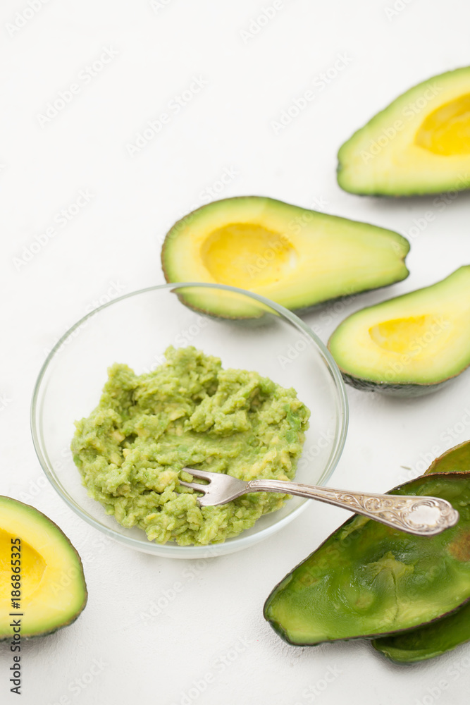 Cooking guacamole avocado on a white table Cooking guacamole avocado on a white table