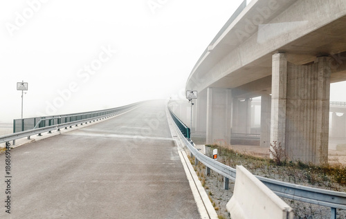 Empty road junction in the fog