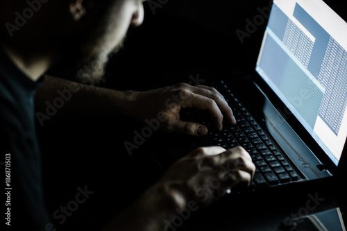 Naklejka Russian hacker hacking the server in the dark