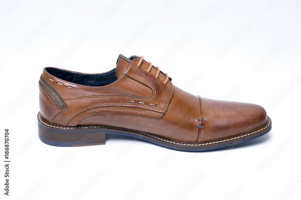 Male brown leather shoe on white background, isolated product, comfortable footwear. Male brown leather shoe on white background, isolated product, comfortable footwear.