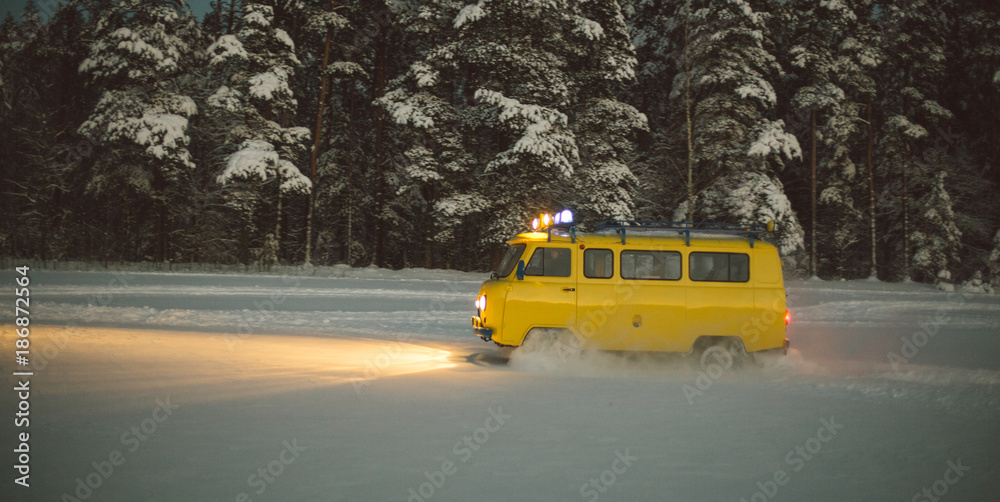 Obraz premium vintage ussr yellow van winter snow forest