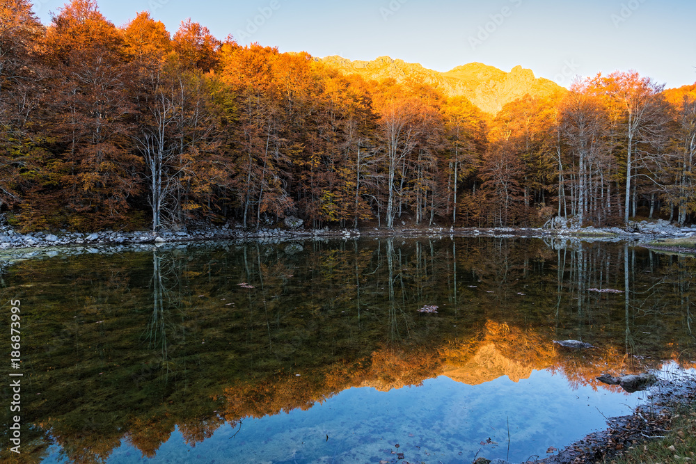 View of Arrenes or Moutsalia alpine lake on Mt Grammos in Greece during autumn
