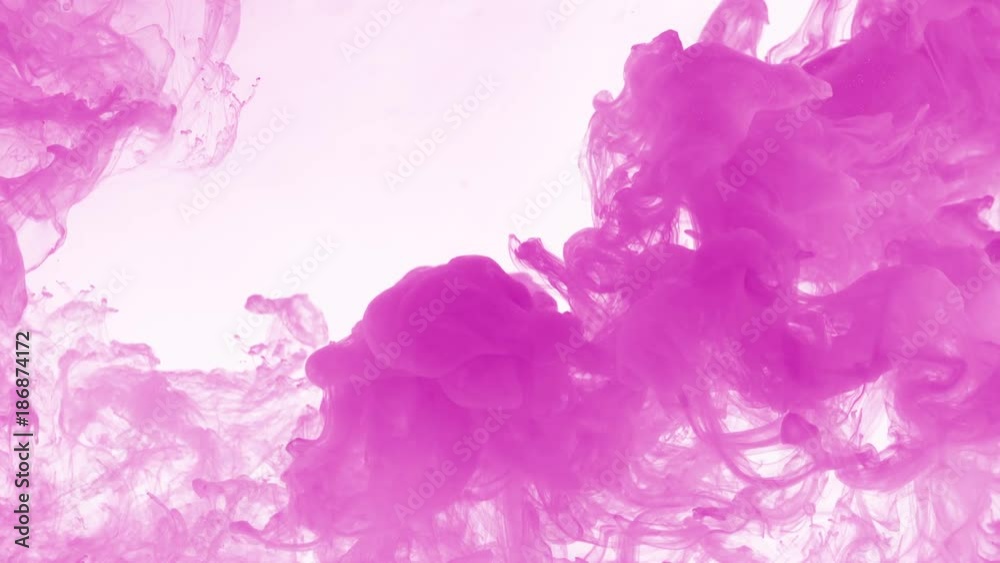 Pink ink dropped in water on white background