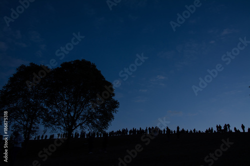 siluate of  people with big tree at Doi Samer Dao  in Sri Nan National Park ,  Nan Province of Thailand photo