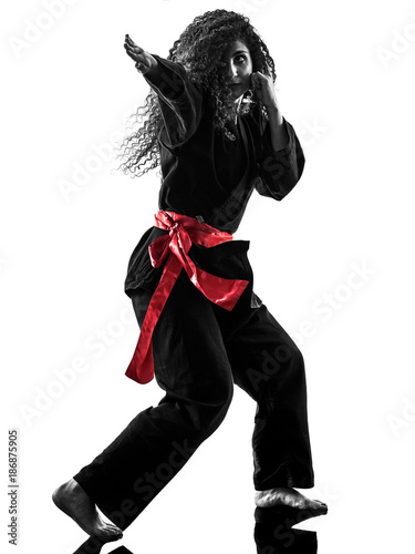 one caucasian woman practicing martial arts Kung Fu Pencak Silat in studio isolated on white background