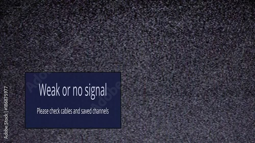 Static noise of an old analog tv screen. A box with two rows of text (Weak or No Signal, Please check cables and saved channels) moves on random locations.
