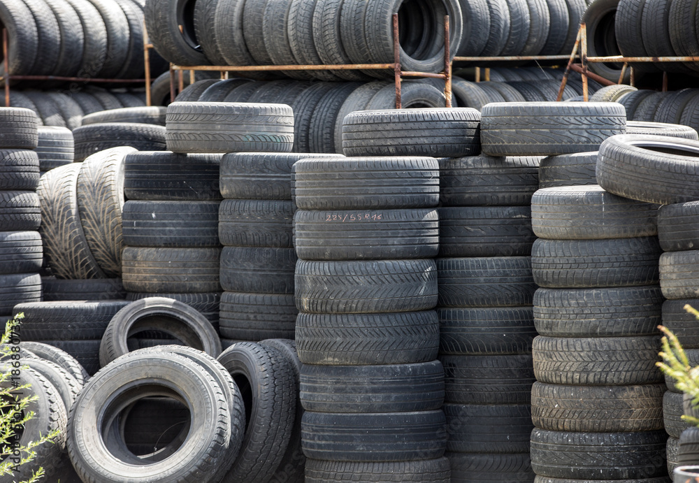 A large stack of used automotive car tires A large stack of used automotive car tires