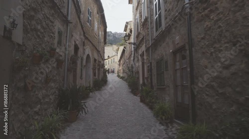 Medieval narrow cobblestone street in Valdemossa village photo