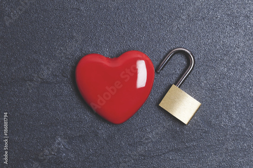 Valentines love concept. Red heart with padlock