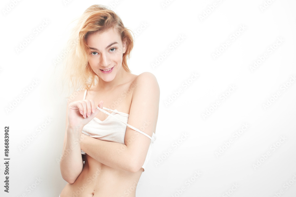 Obraz premium Sexy young blonde girl on white background
