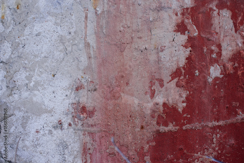Textured background. Old concrete wall with red paint