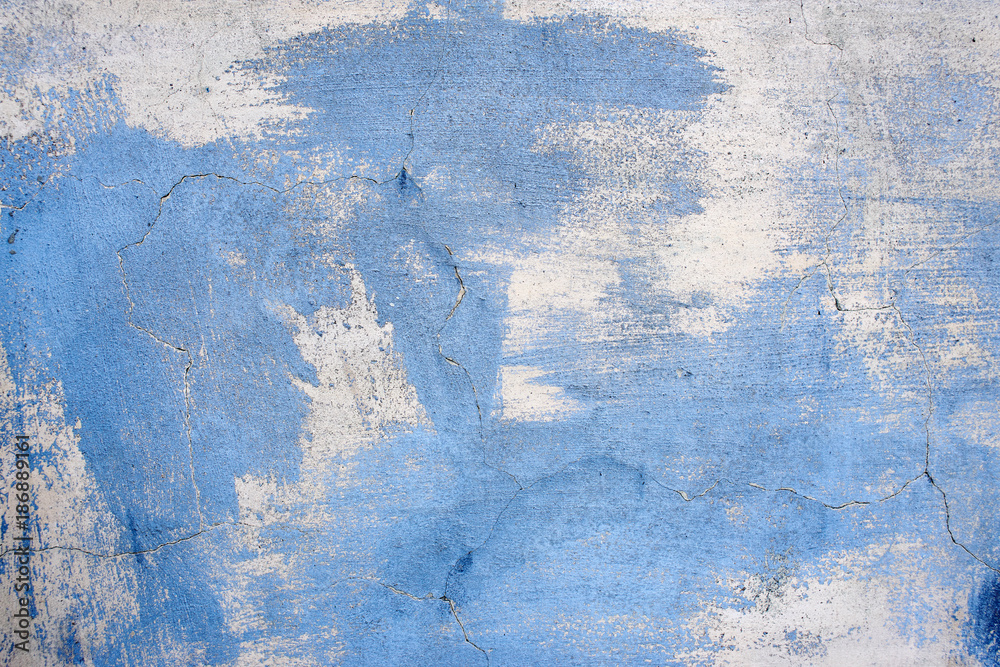 Obraz premium Textured background. Old gray concrete wall with stains of blue paint for the lettering