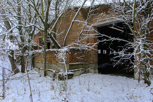 Old destroyed by time and vandals industrial building of the times of the USSR. December 2017 photo