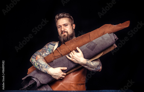 Leather master cuts out leather goods