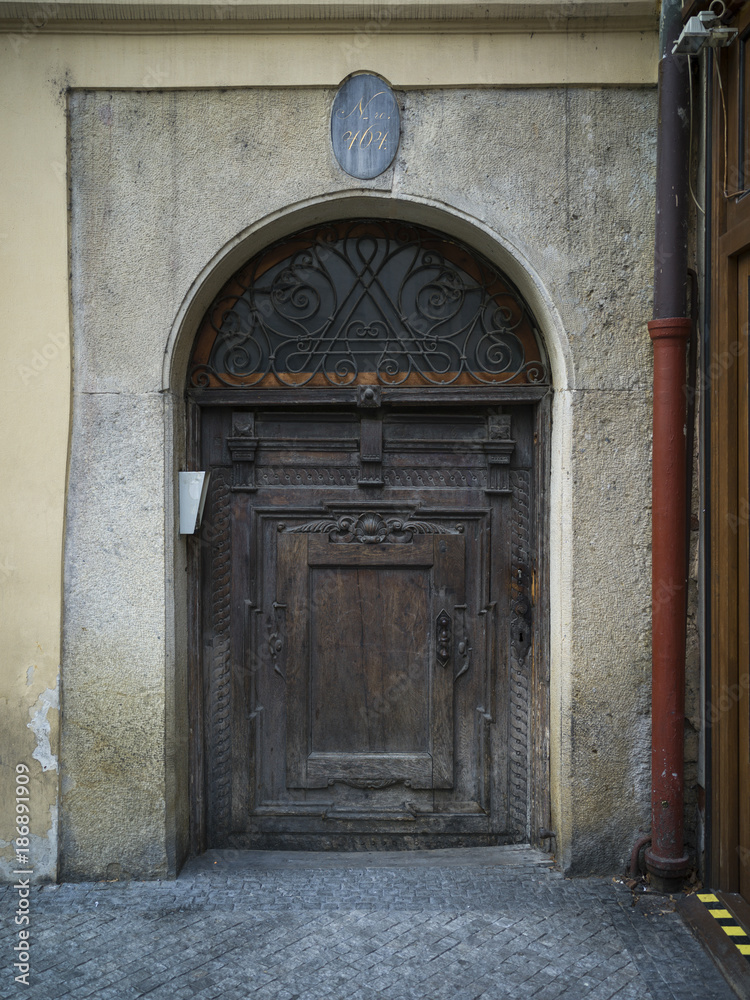 Closed wooden door of a house, Prague, Czech Republic