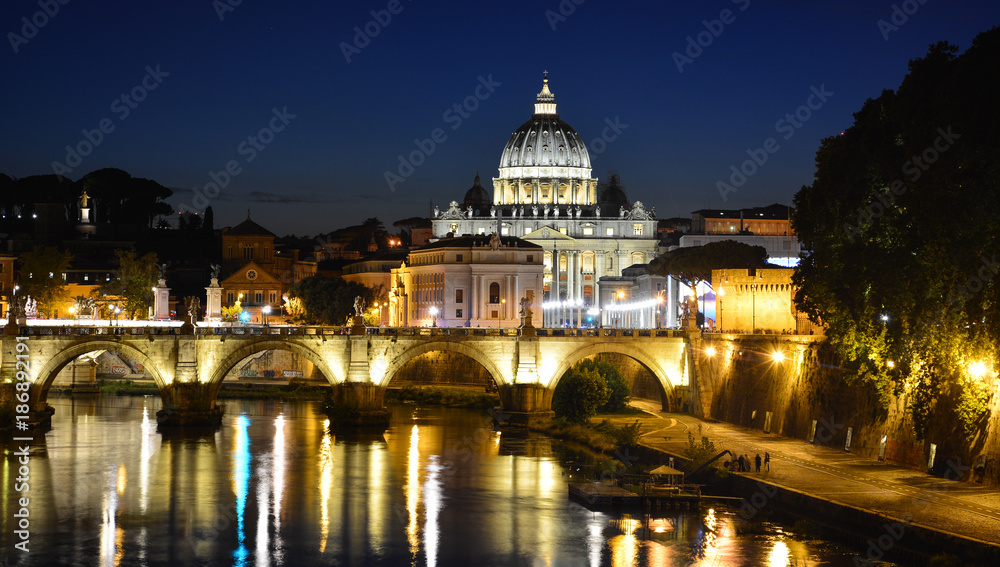 Night view of Tiber with St. Peter's Basilica and Ponte Sant'Angelo, Rome, Italy